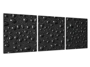 Obraz kapek na černém povrchu
